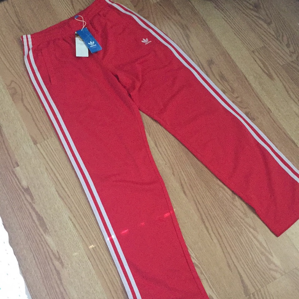 Red adidas track pants